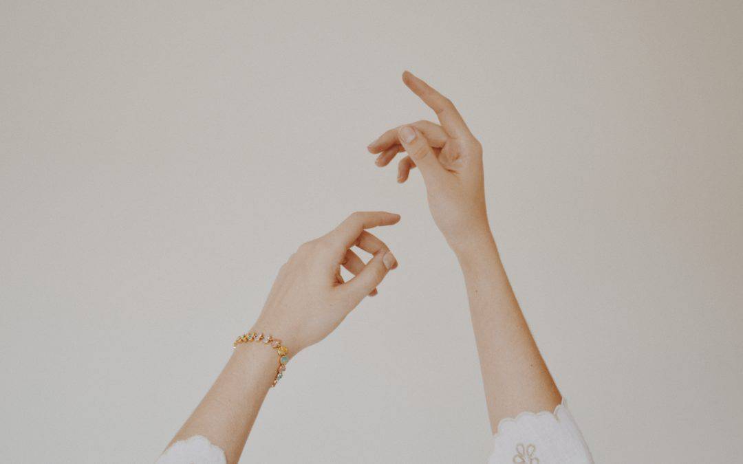 hands against white background arthritis flares